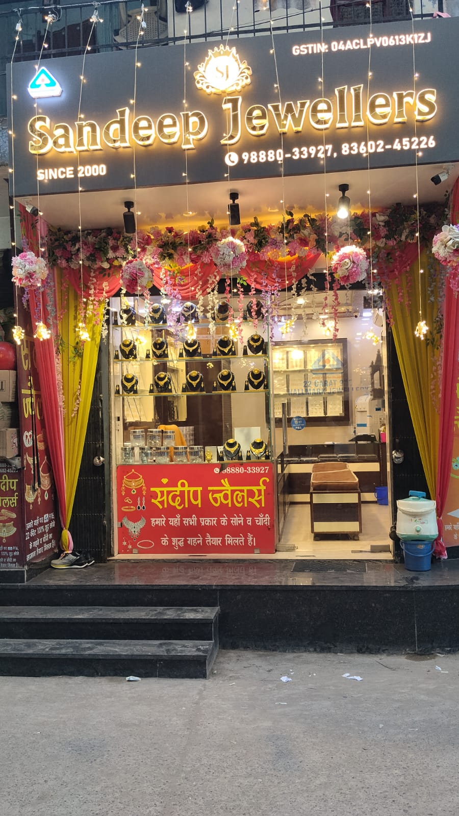 Sandeep Jewellers storefront in Kajheri, Sector 52, Chandigarh, decorated with flowers and lights